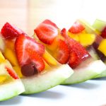 These Watermelon Jello Shots are bursting with delicious fruity flavors with a beautiful presentation that's perfect for a party! Fresh fruits are molded in jello inside a half watermelon with your favorite rum or vodka. Plus video tutorial!