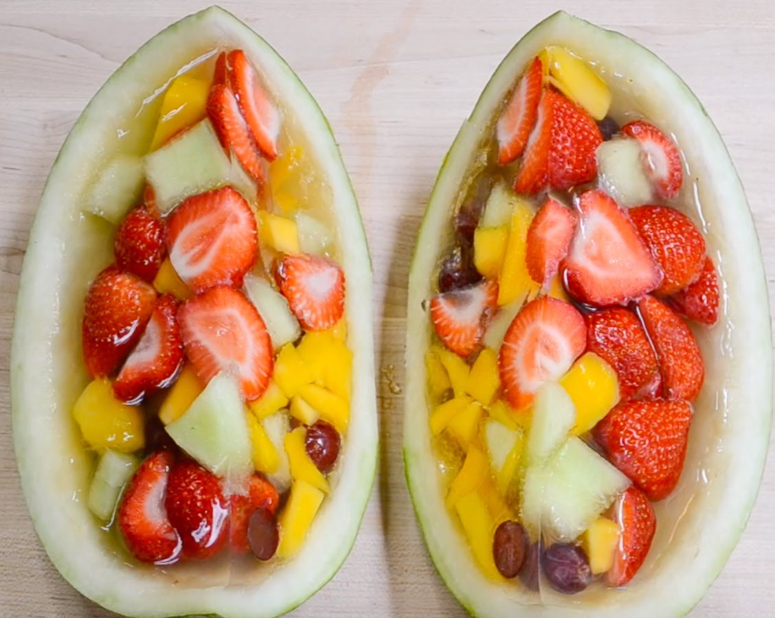 These Watermelon Jello Shots are bursting with delicious fruity flavors with a beautiful presentation that's perfect for a party! Fresh fruits are molded in jello inside a half watermelon with your favorite rum or vodka. Plus video tutorial!