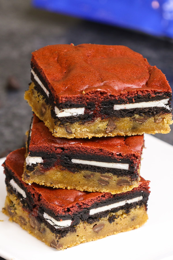 A stack of slutty brownies made with red velvet cake mix instead of brownie mix